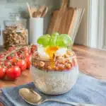 Tomato Basil Overnight Oats in glass jar topped with basil