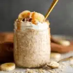 Banana bread mush overnight oats in a jar on rustic kitchen counter