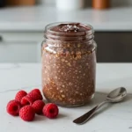 Chocolate smash-top oats with glossy chocolate shell in modern kitchen
