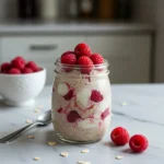 Raspberry Cheesecake Overnight Oats in a jar