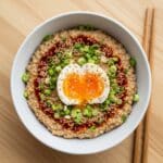 savory oats bowl with chili oil and egg