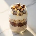 Kinder Bueno overnight oats with creamy hazelnut layers and wafer topping